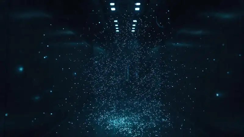 Enjambre de partículas luminosas en ambiente futurista